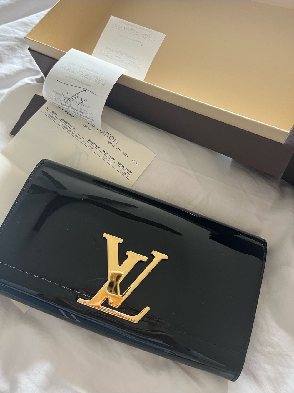 Louis Vuitton Black Patent Clutch with Gold LV Emblem.